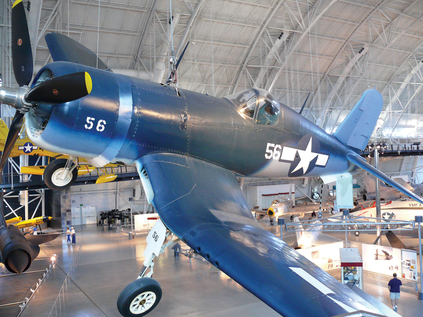 As if seen in flight, this Vought-Sikorsky U.S. Navy Corsair R4U hangs close to a visitor viewing platform.