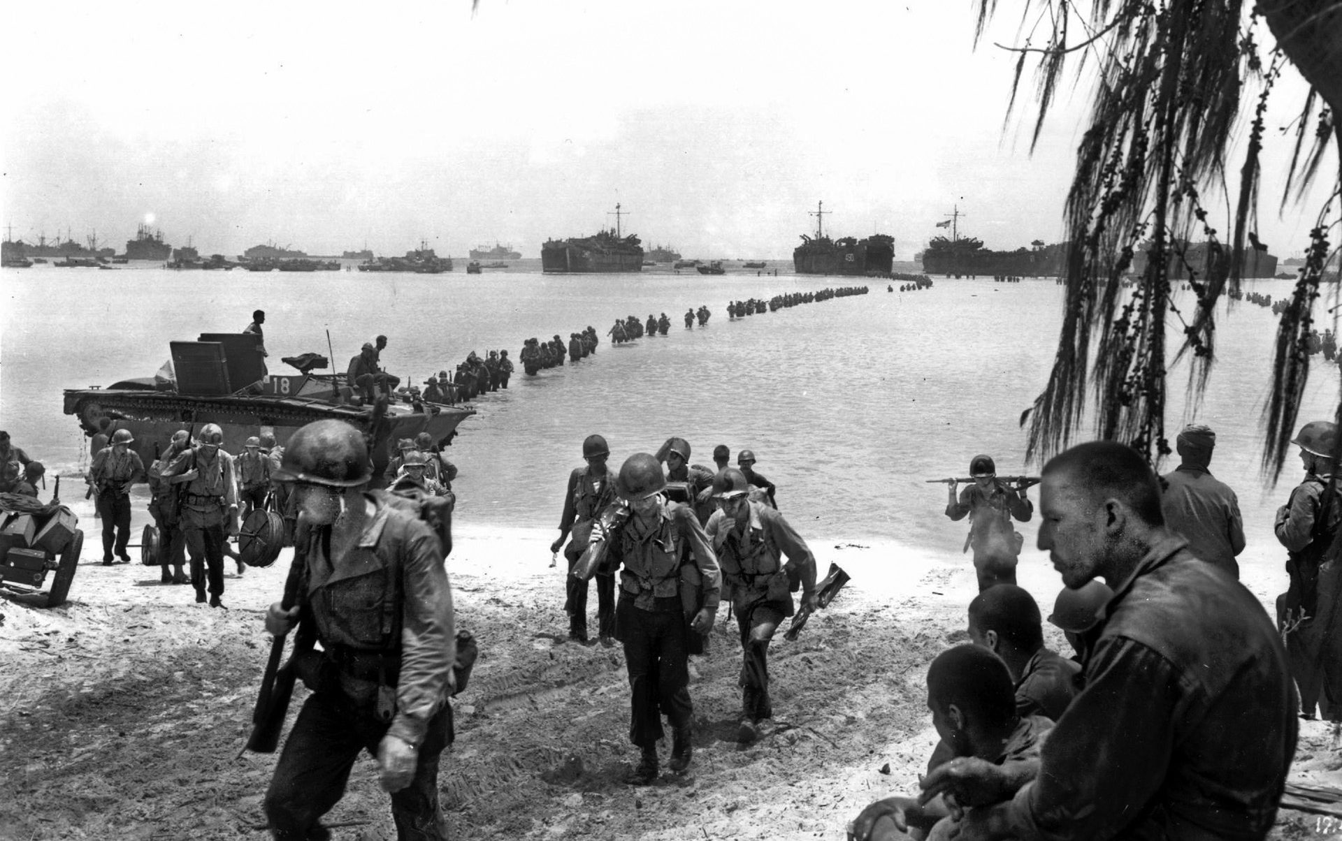 A long line of reinforcements from the U.S. Army’s 27th Infantry Division wade ashore. “Bad blood” between the “two Smiths” on the island resulted in the 27th’s commanding general being relieved of command.