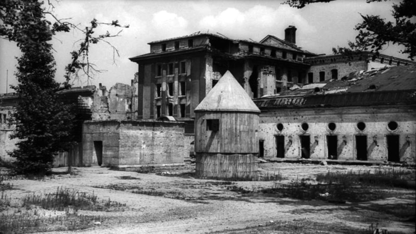  Located beneath the garden of the Reich Chancellery, the Führerbunker was built in secrecy and served its purpose to the end. This photo depicts the entrance to the bunker at left adjacent to the bomb shelter that was used by guards posted there. 