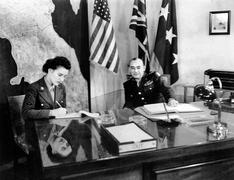 T-3 Mary Noonan Westerman takes dictation from her boss, Lt. Gen. McNarney, Deputy Allied Commander in Italy, November 1944. 