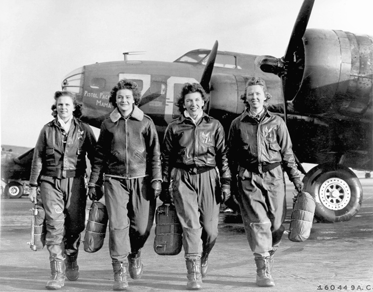 Members of a WASP crew pose for a publicity photo beside <a href=