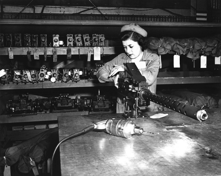 Women held a variety of non-traditional jobs. Here Marion Pillsbury, a Marine Women Reservist, assembles a .50-caliber machine gun at the San Diego Marine Corps base.