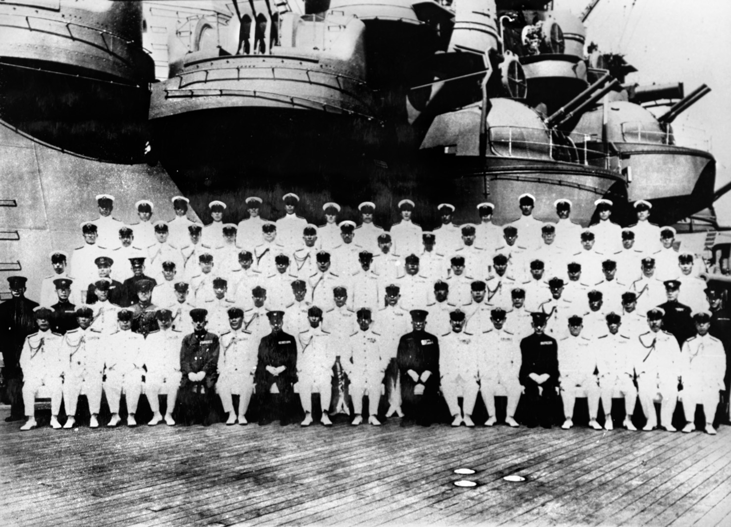 The Japanese emperor, Hirohito (front row, center), photographed with officers of the Imperial Navy aboard the battleship Musashi off Yokosuki Naval Base on June 24, 1943. The ship had returned to Japan carrying the ashes of Admiral Isoroku Yamamoto, who had been shot down by American P-38s on April 18, 1943.