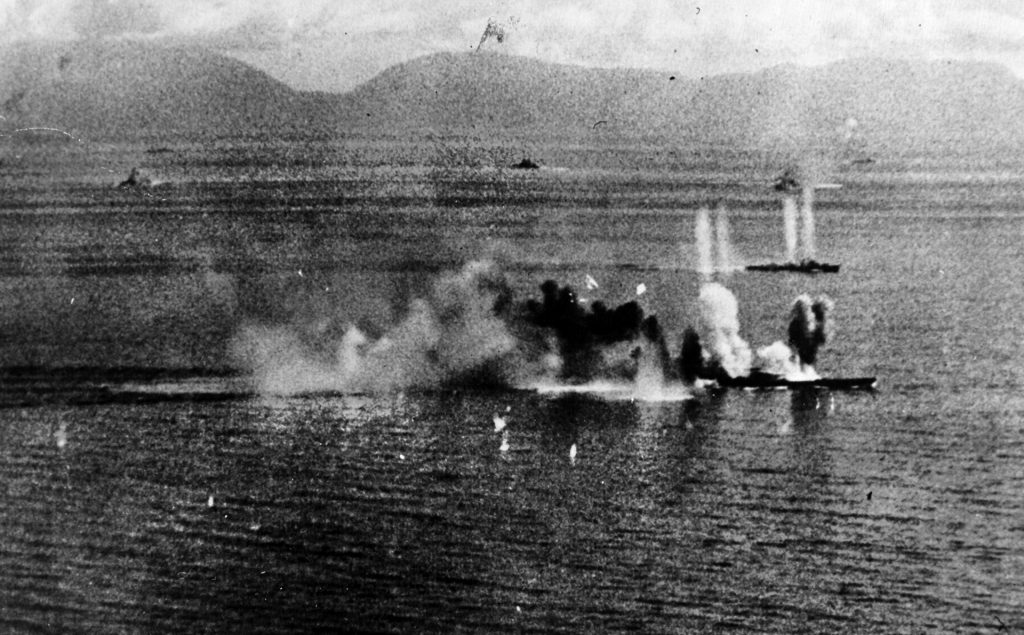 Warplanes from Task Force 38 swarm around Musashi (foreground) and a destroyer in the Sibuyan Sea, October 24, 1944. The IJN’s back was broken during the Battle of Leyte Gulf, never to recover.