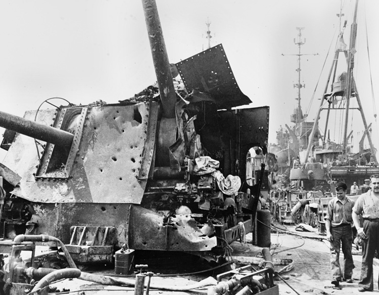 The shattered 3.5” gun mount aboard the USS Laffey. The ship was attacked by 22 Japanese planes on April 16, 1945, and struck by four bombs and five suicide planes. Thirty-one sailors were killed, 72 wounded.