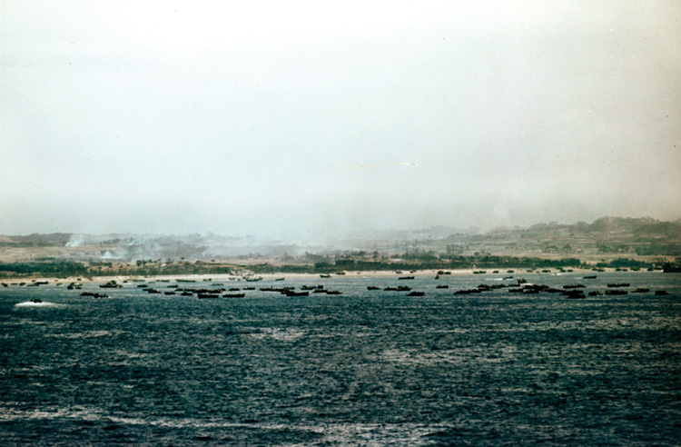 A panoramic color photo showing scores of landing craft and LTVs during Operation Iceberg—the invasion of Okinawa on L-Day, April 1, 1945.
