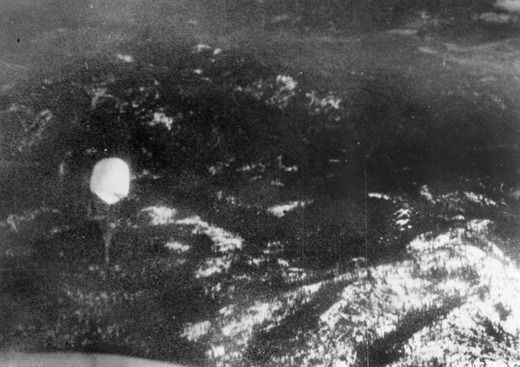 Photo taken by an American reconnaissance plane shows a Japan-launched balloon bomb floating over forested terrain in the Pacific Northwest. Many  of these weapons were tracked by American and Canadian fighter aircraft. 