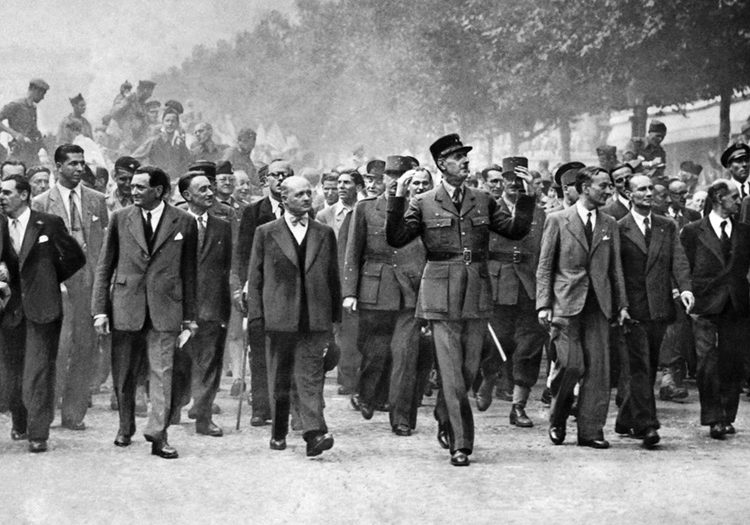 General Charles de Gaulle and his entourage march triumphantly down the Champs-Élysées. He refused to duck or flinch when snipers’ bullets were aimed his way.