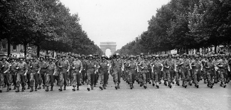 The Americans arrive: Four days after the liberation, the 28th Infantry Division, Pennsylvania National Guard, marches down the Champs-Élysées accompanied by cheers from the Parisians.