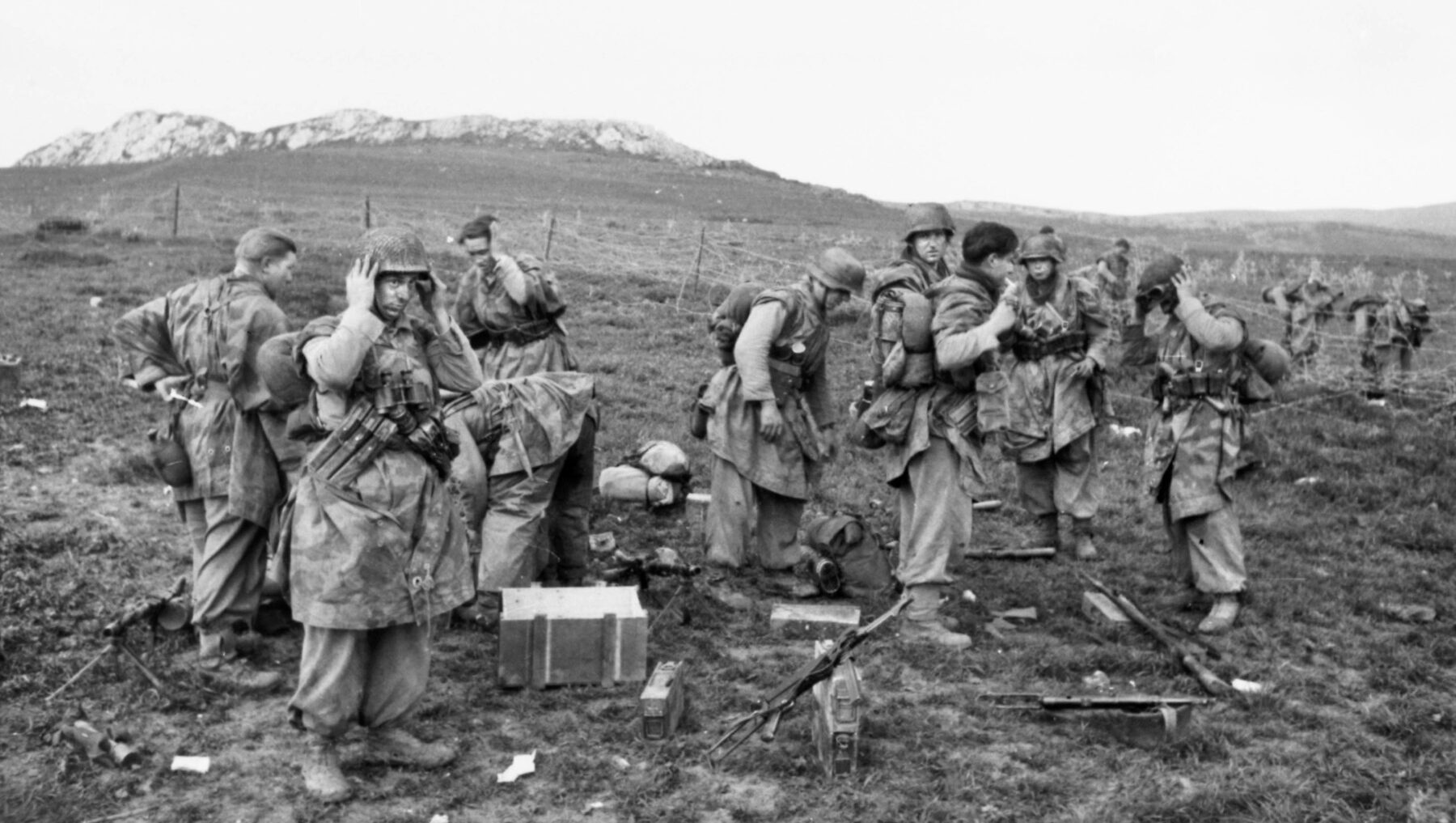 German infantrymen check weapons and stock up on ammunition during the battle for Kasserine Pass.