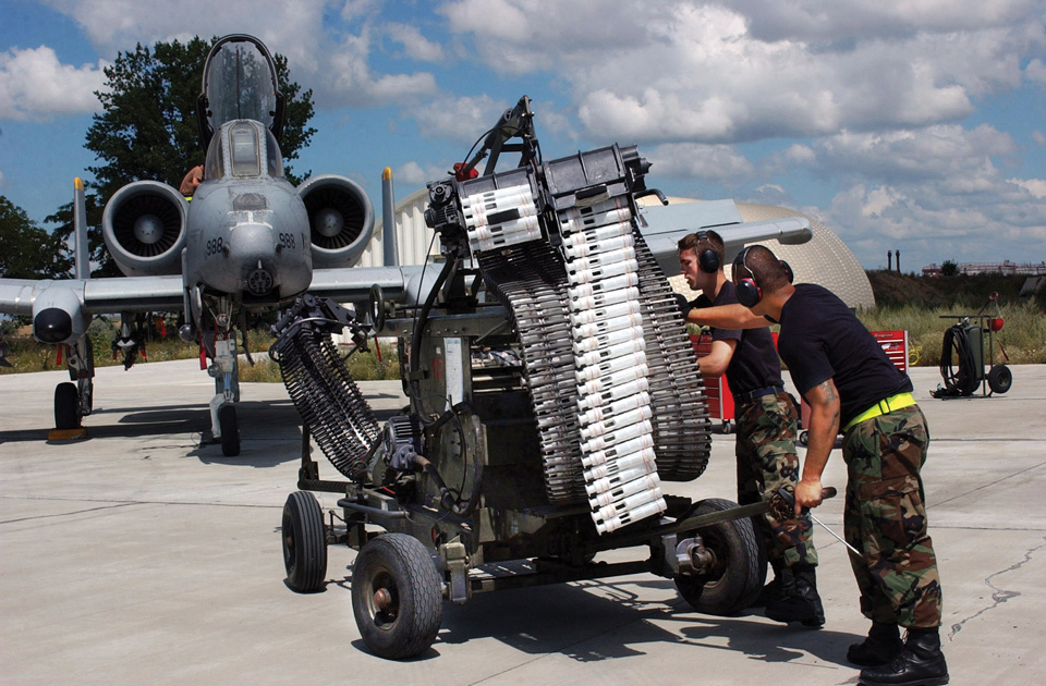 Crewmen load the GAU-8/A Avenger autocannon with 30mm rounds. The weapon platform is so large that the aircraft is literally built around it. 