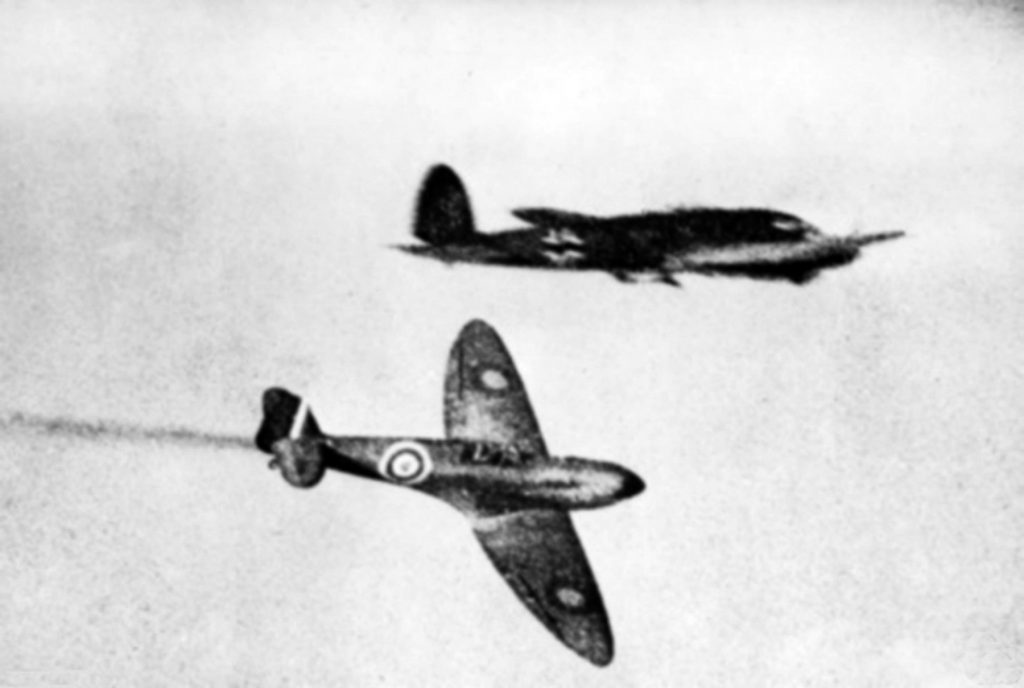 Trailing a wisp of smoke, an RAF Spitfire continues its pursuit of a Luftwaffe He-111 during the 1940 Battle of Britain. “Cowboy” Blatchford dogged a German bomber until it crashed into the sea during a mission in the autumn of 1939.