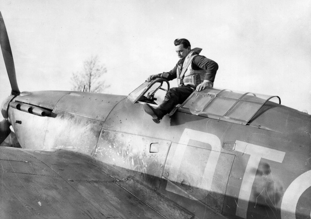 Flight Lieutenant Howard “Cowboy” Blatchford climbs from the cockpit of his Hawker Hurricane assigned to No. 257 Squadron RAF, based at Martlesham Heath.