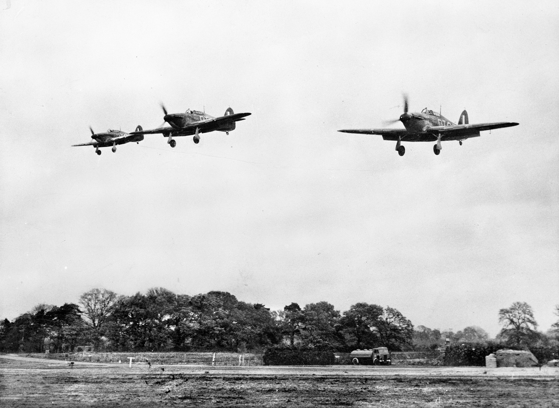 Flying the center aircraft in this trio of Hawker Hurricane fighters from No. 257 Squadron RAF, Squadron Leader Tuck guides the formation in for a landing at Martlesham Heath in November 1940.