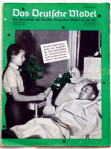 The cover of the official magazine for the Federation of German Girls (BdM) of the Hitler youth shows a young girl bringing flowers to a a bedridden soldier. The text of the insert reads: “With song and play, young women and young girls carry the glad tidings of Christmas eve to our wounded in military hospitals.”