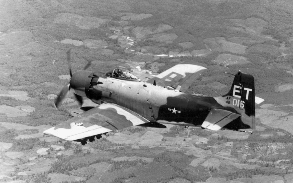 The propeller-driven Douglas A-1 Skyraider, armed with four 20mm cannons and capable of carrying 8,000 pounds of external ordnance, could remain on station over a target much longer than a jet.