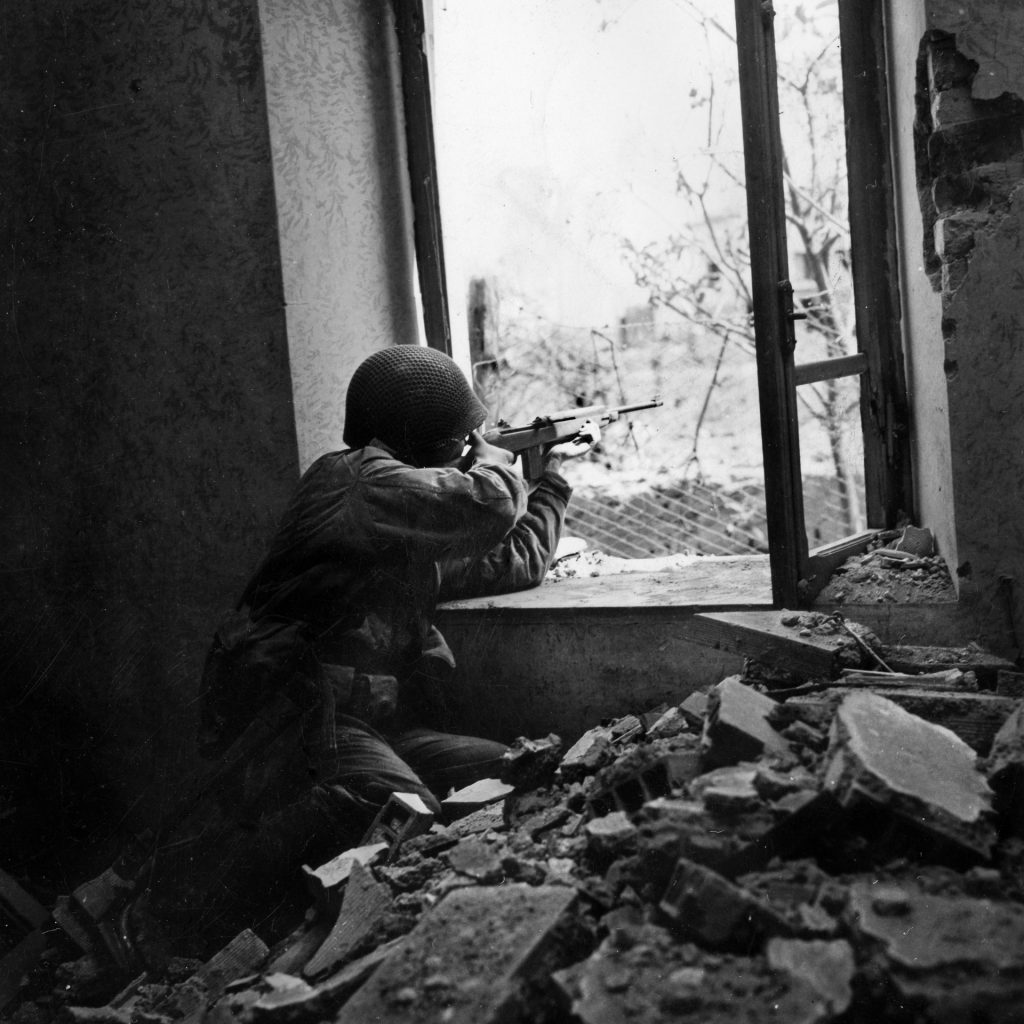 From urban combat to fighting in flat, open fields, from tank-vs.-tank duels, to aerial bombardments to ceaseless artillery barrages, the action at Anzio took on every dimension. Here an American GI uses his carbine to keep German forces at bay during the battle for Anzio that lasted from January to May 1944.