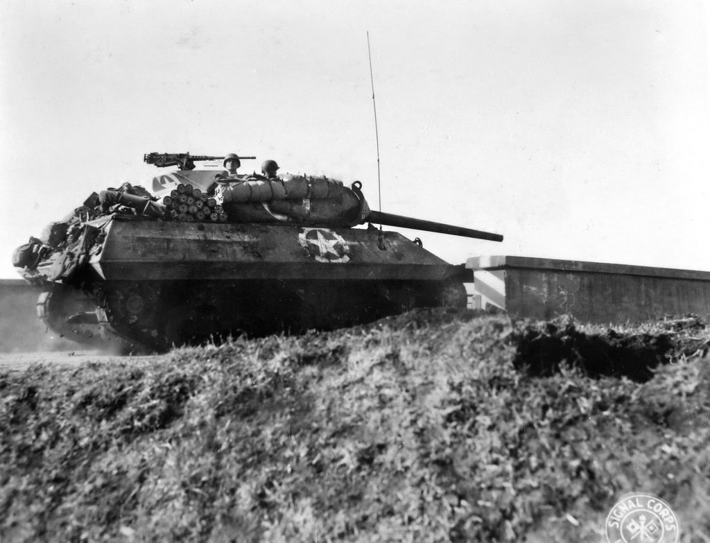 An M-18 Hellcat tank destroyer rolls forward to duel with German armor at Anzio. Captain Felix Sparks had just such a TD save his position from being overrun. 