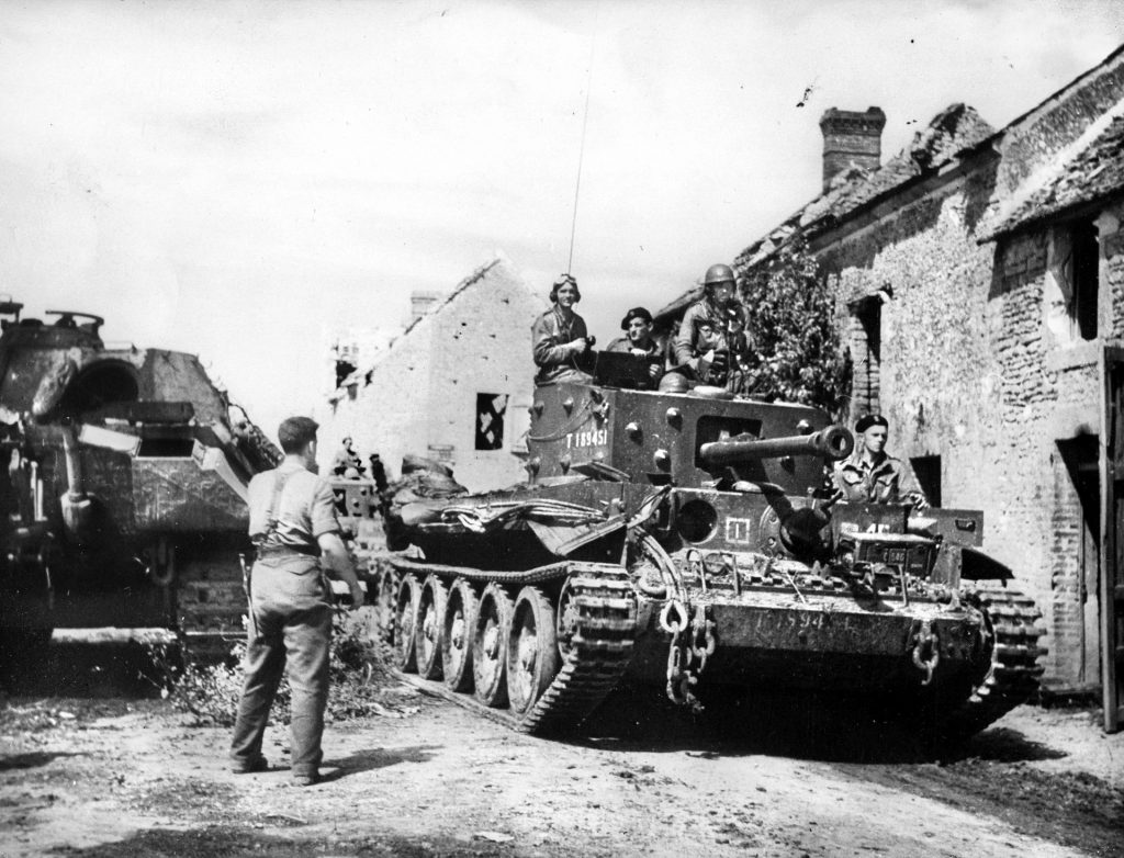 A Cromwell tank of the Polish 1st Armoured Division rolls through a French village on its way to Mont Ormel, where the unit would make its courageous, storied stand.