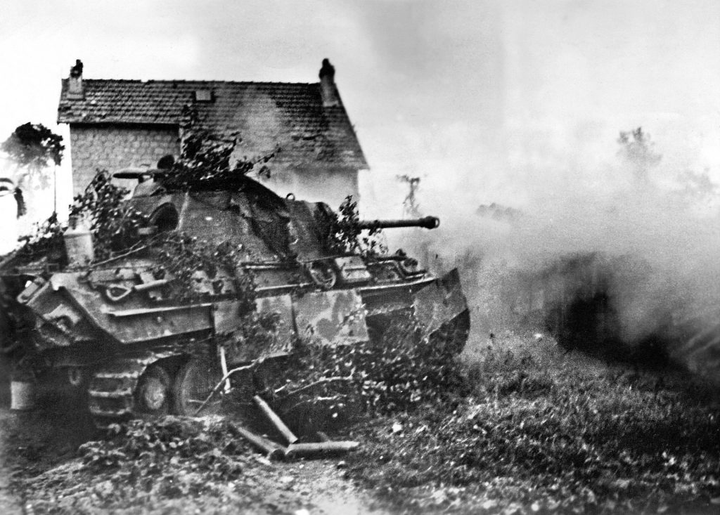 A German Panther blasts an enemy position during combat in Normandy, August 1944. 