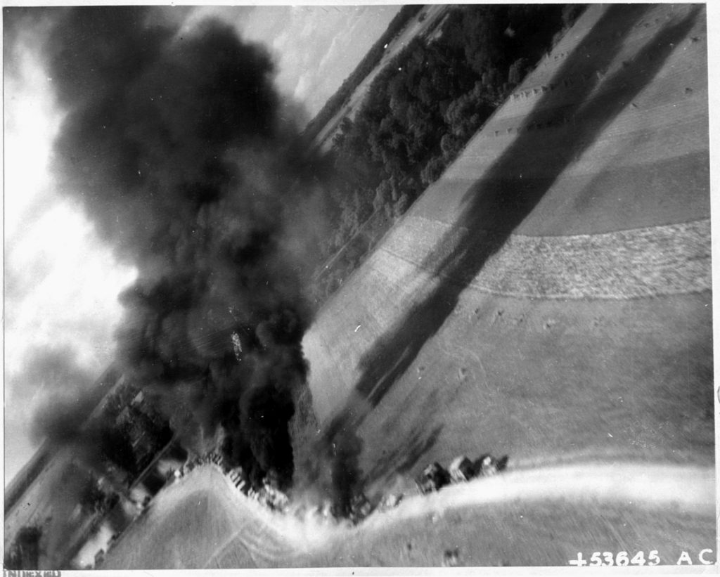 A gun-camera view of a German convoy being attacked in France. Thousands of German vehicles, planes, and railroad rolling stock were destroyed by XIX TAC pilots. 