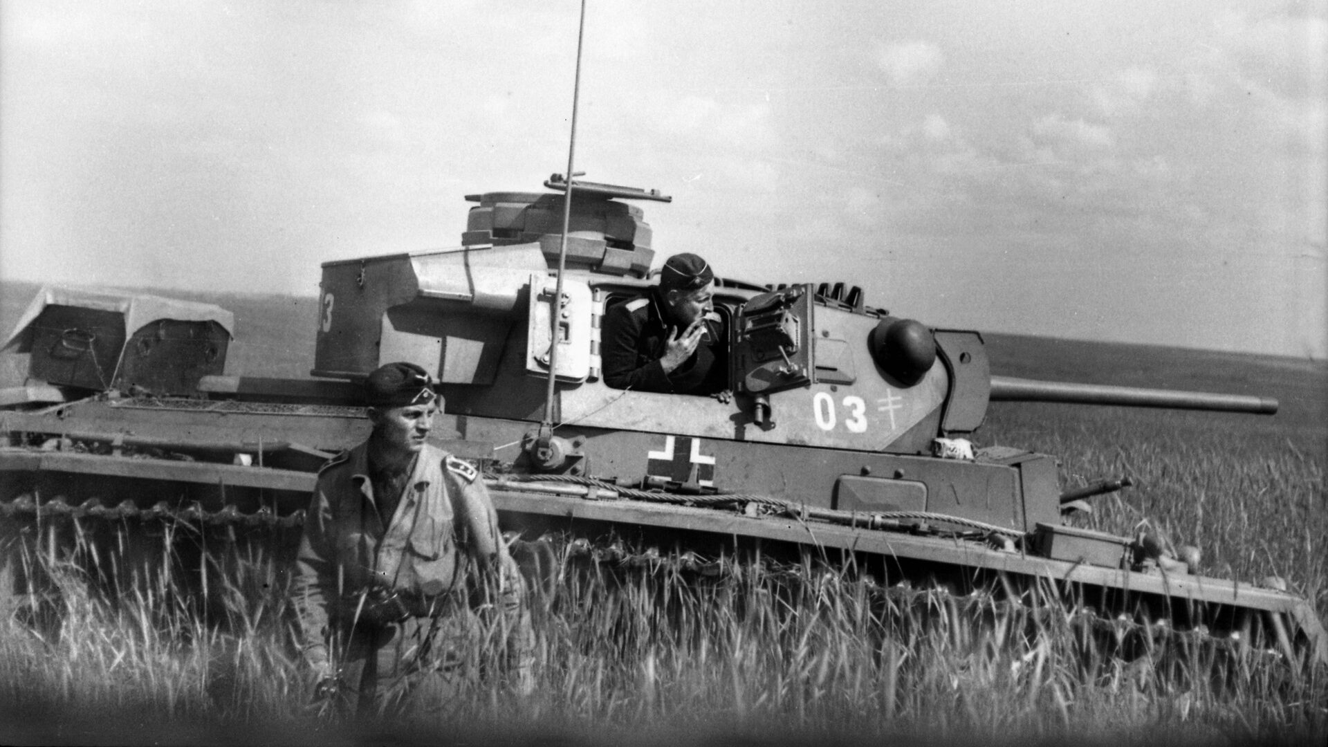 A German tanker stands on the Russian steppe near Voronezh after emerging from the turret of his PzKpfw. III tank. In the summer of 1942, Hitler mounted an armored thrust to the south along the Eastern Front, and it led to ruin.