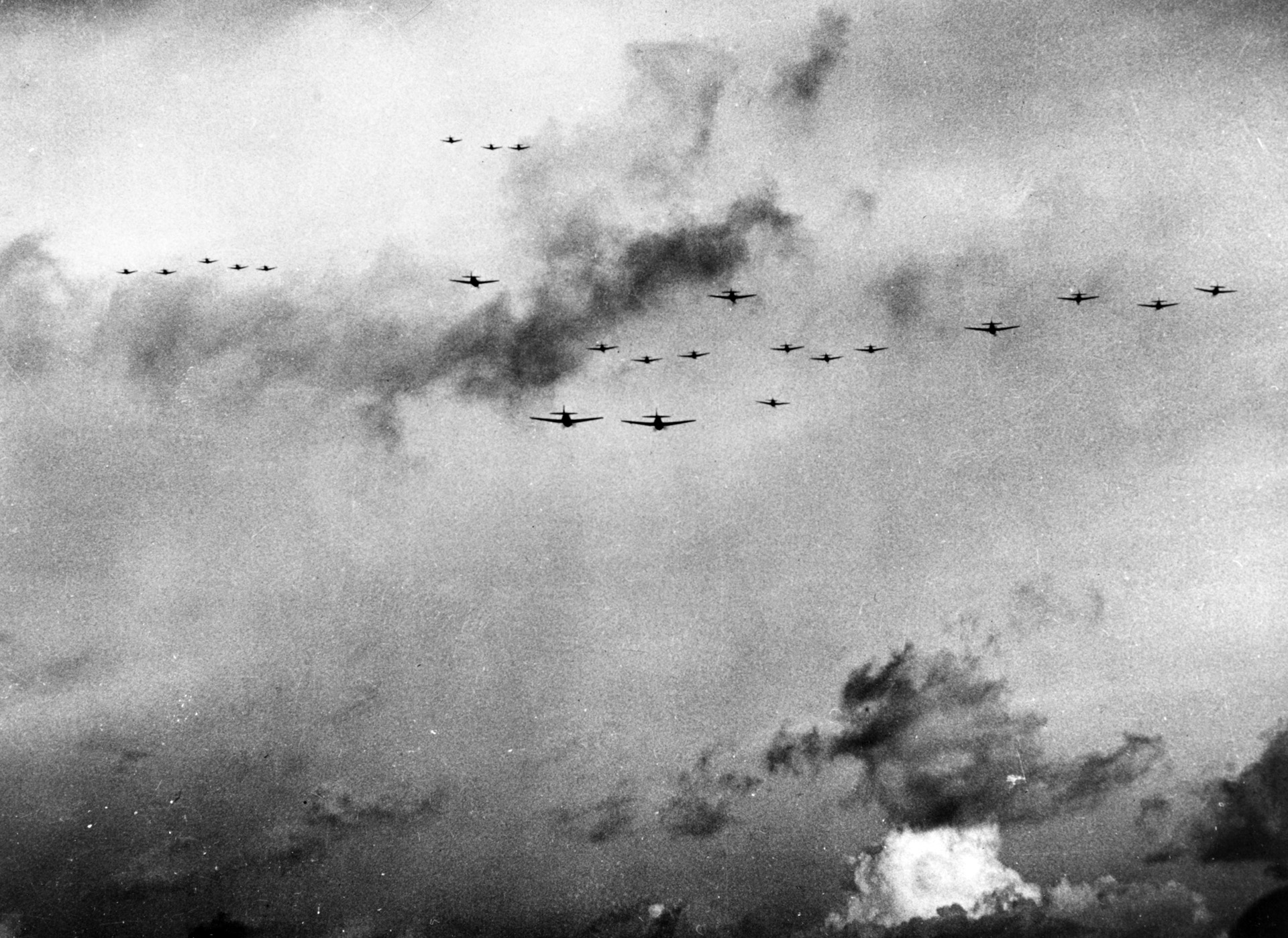 An impressive flight of 23 Grumman F6F Hellcat fighter planes launched by aircraft carriers of U.S. Task Force 58 assembles to ward off attacks against American ships during the battle.