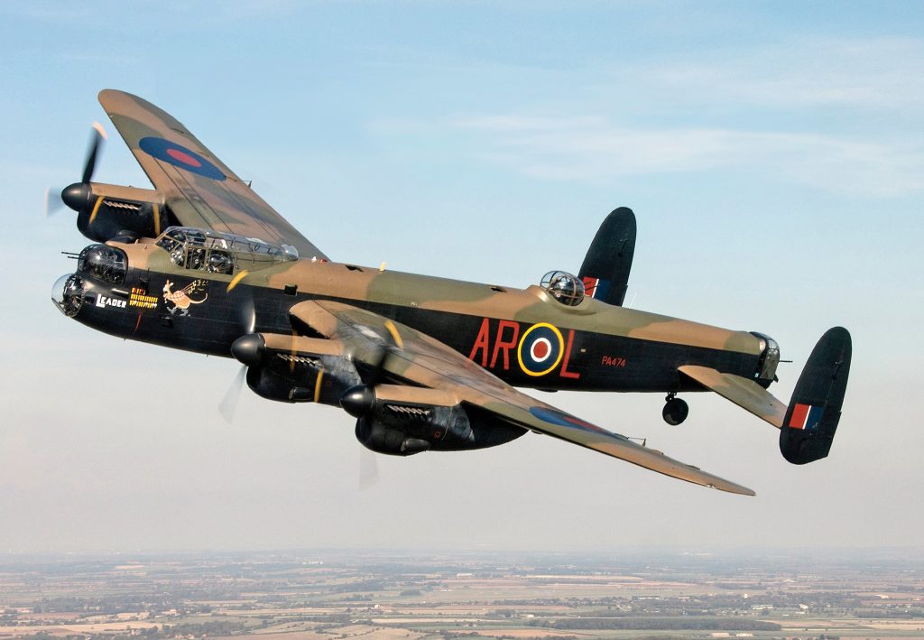 Flying above Lincolnshire, vintage Avro Lancaster PA474 from the Battle of Britain Memorial Flight (BBMF) is painted in camouflage and markings of No. 460 Squadron Royal Australian Air Force.