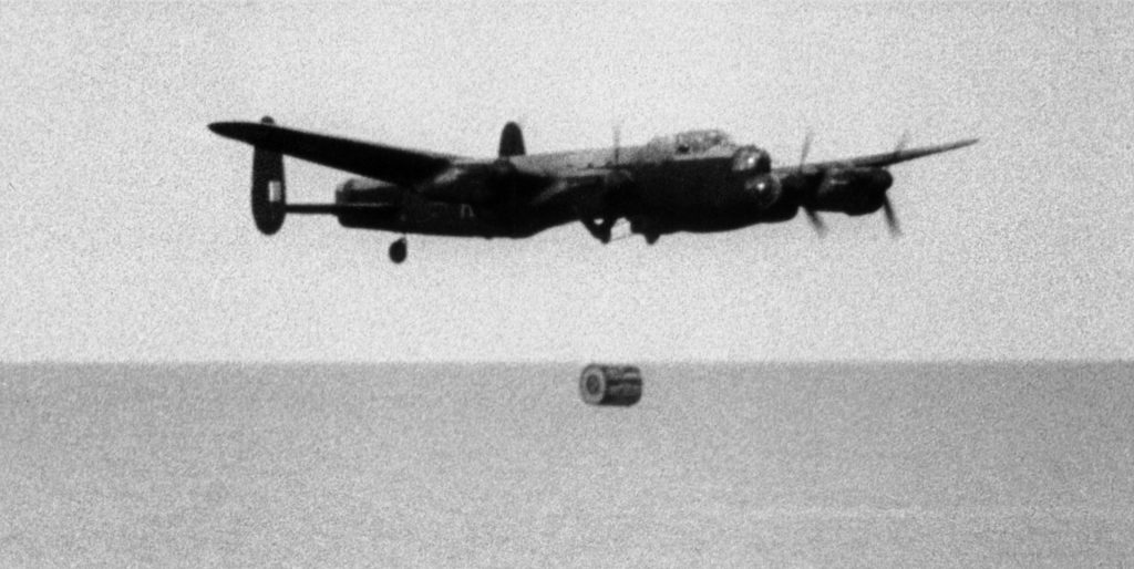 This Avro Lancaster heavy bomber of No. 617 Squadron RAF engages in training for Operation Chastise. During its training run, the bomber drops the Upkeep weapon on the bombing range at Reculver, Kent.