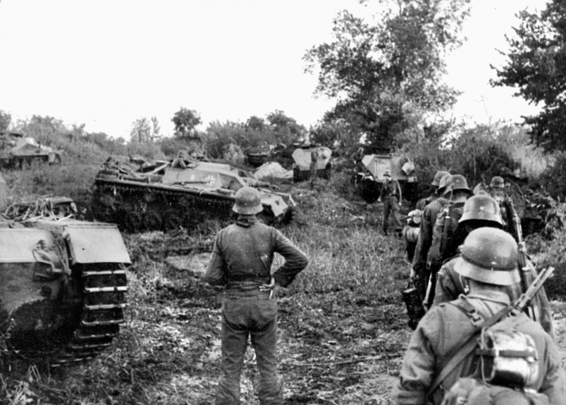 German infantry and armored vehicles move through the countryside of Hungary as they attempt to stem the tide of the Russian advance toward their own borders. .