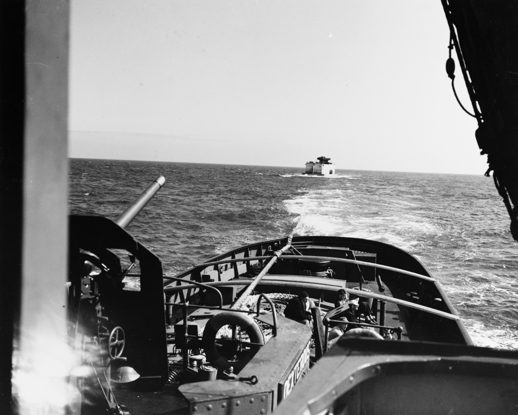 A Phoenix caisson is towed across the English Channel toward the beaches of Normandy.  These components were towed at speeds of just three or four knots.