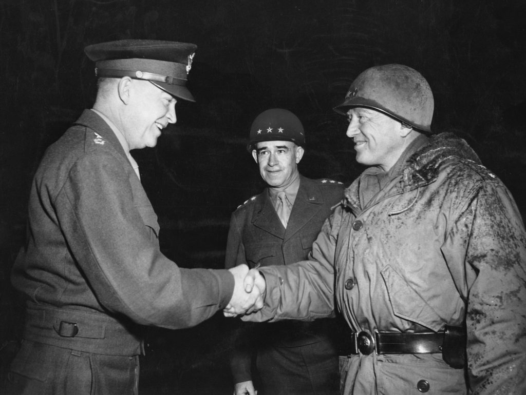 Eisenhower, Bradley, and Patton photographed before the German surrender. Eisenhower later relieved the outspoken Patton of command of Third Army after comments he made as the military governor of Bavaria.