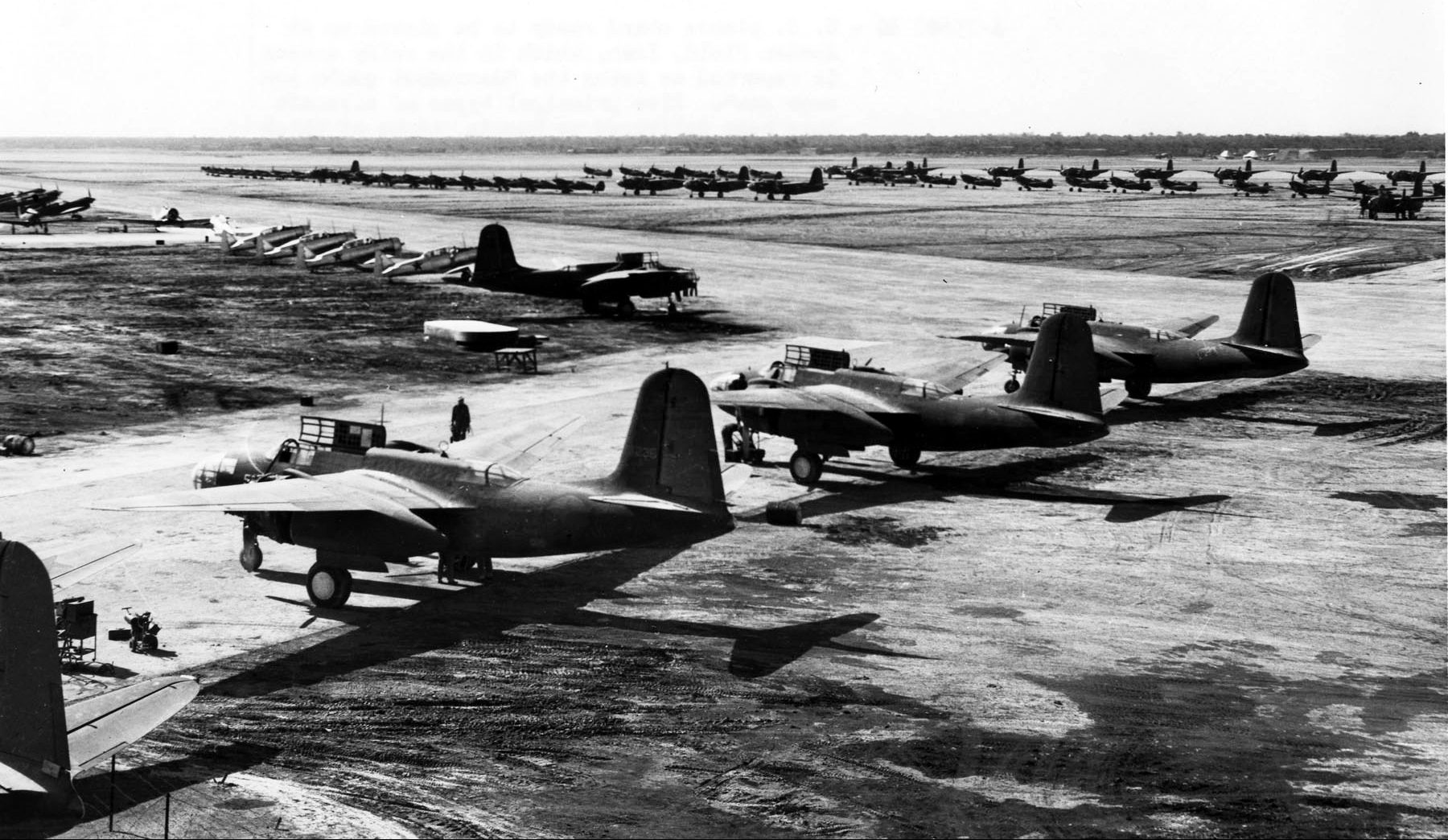 Aircraft manufactured in the U.S. await their new owners, the Soviet Red Air Force, at an airfield in Iran. The U.S. supplied several types of aircraft to the Soviet Union through Lend-Lease, including the A-20, P-39, P-40, B-25, and AT-6.