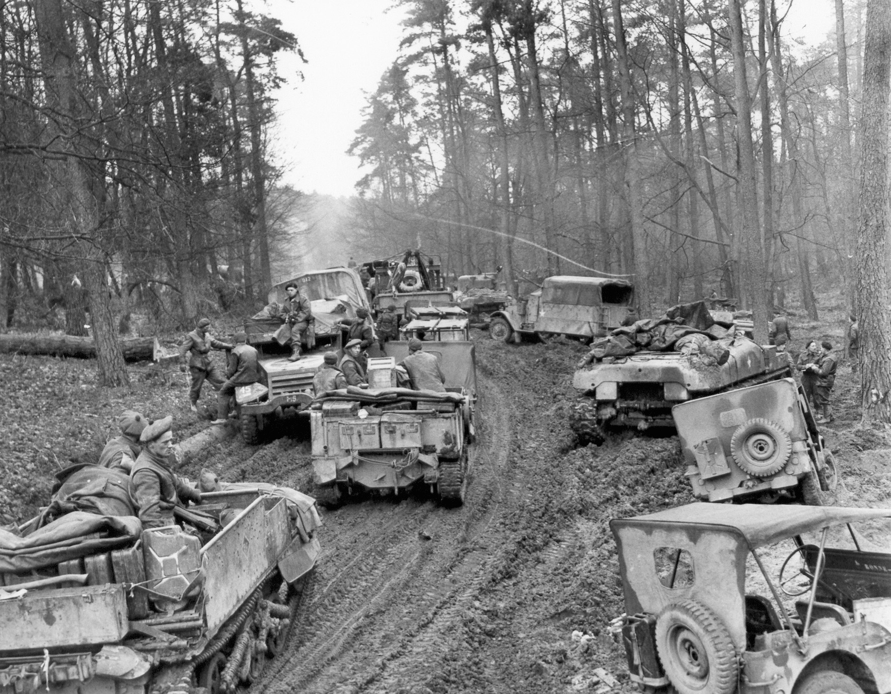 The soggy roads that traversed the Reichswald were a tremendous obstacle to Allied offensive movement. In this image, Canadian vehicles are mired in the muck, creating a huge traffic jam and slowing Field Marshal Montgomery’s timetable.