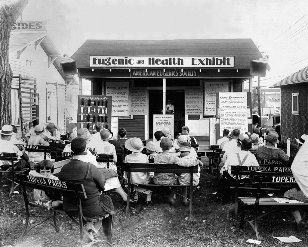 This image from the 1929 Kansas State Fair depicts a crowd gathering for a eugenics and health exhibit and accompanying lecture. Similar disturbing events took place at state fairs across America in the 1920s.