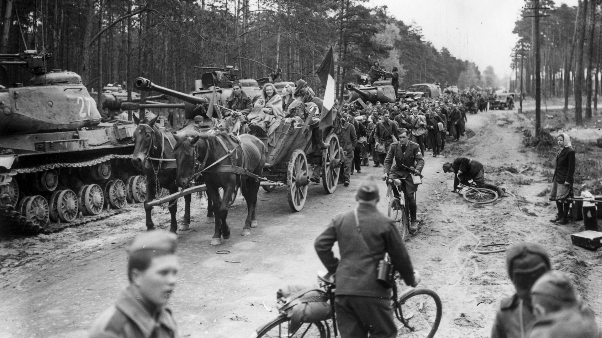 French citizens forced by the Nazis to work as slave labor finally begin their trek toward home after the fall of Berlin in the spring of 1945. The Nazis routinely exploited conquered peoples, requiring them to work in deplorable conditions.