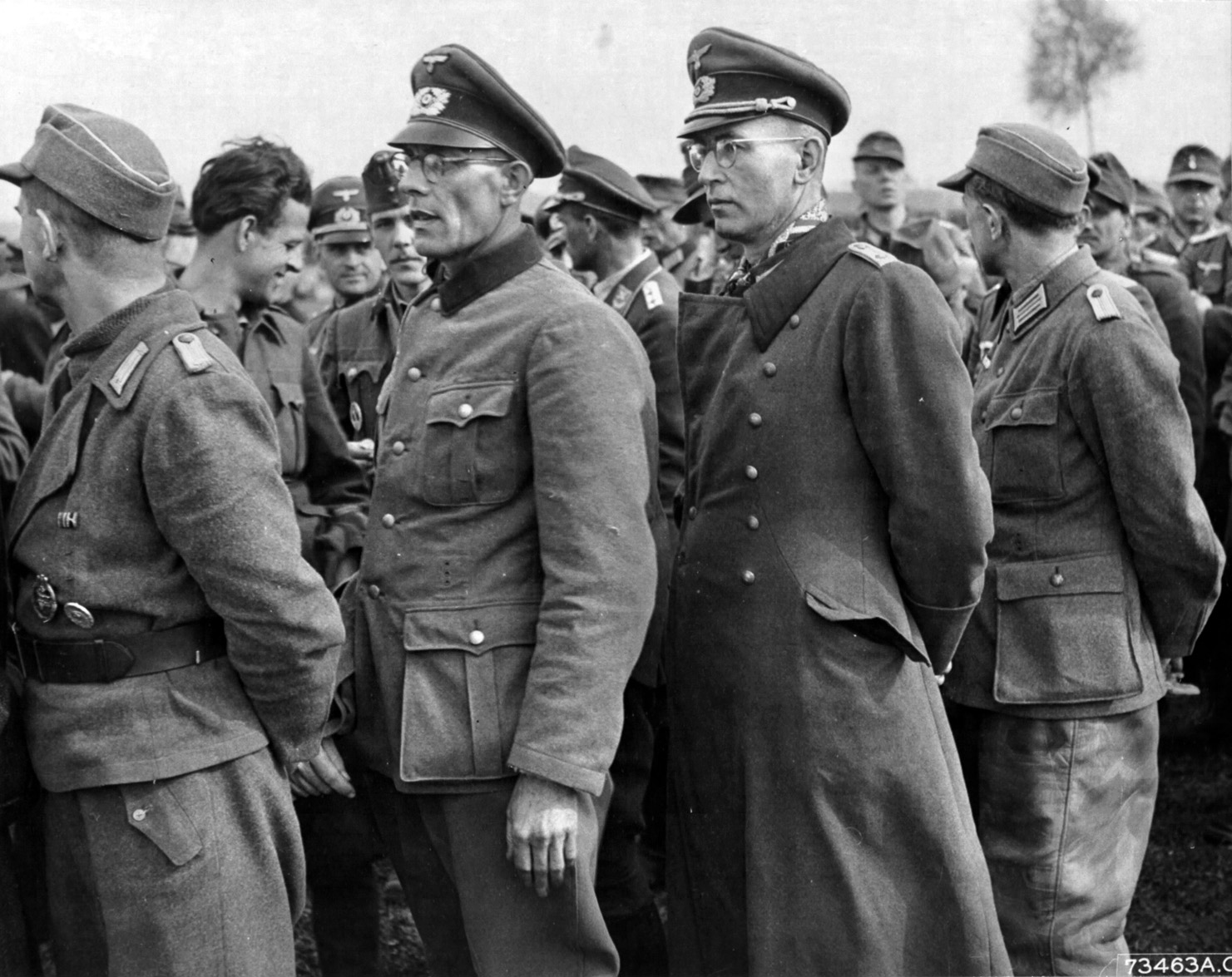 German Army officers stand in line for processing after their surrender in 1945. Most officers below the rank of colonel were allowed to go home after a brief period of captivity.