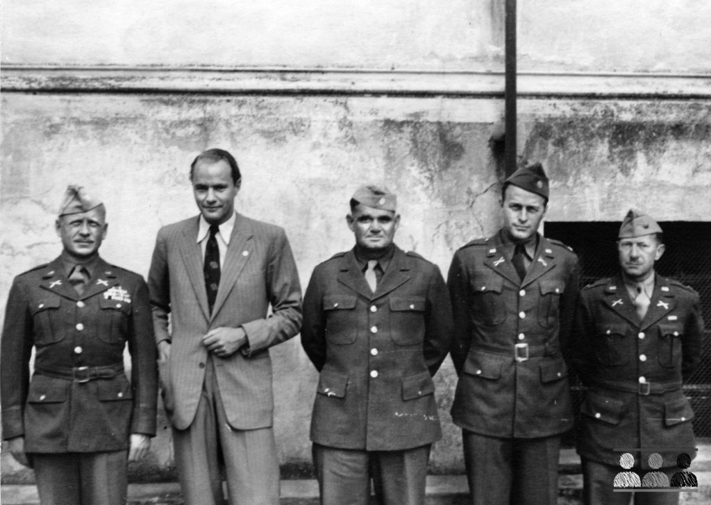 A Red Cross official stands second from left in this photo taken at Oflag 64. Colonel Thomas Drake is at far left, while Lt. Col. William Schaefer is third from left. At right is Lt. Col. John Waters, son-in-law of Lt. Gen. George S. Patton, Jr.