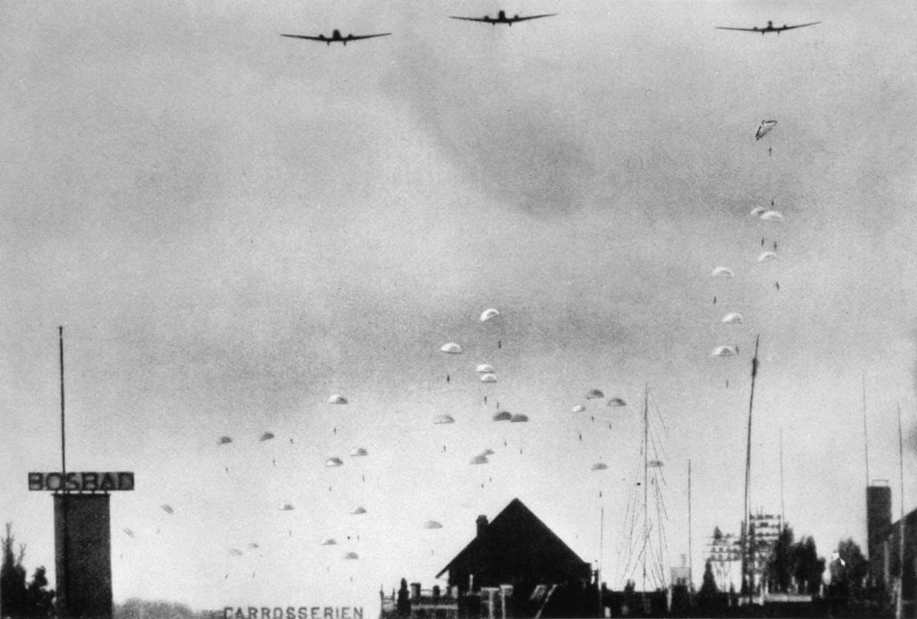 German Junkers Ju-52 transport aircraft release their cargoes of paratroopers during the invasion of the Netherlands on May 10, 1940.