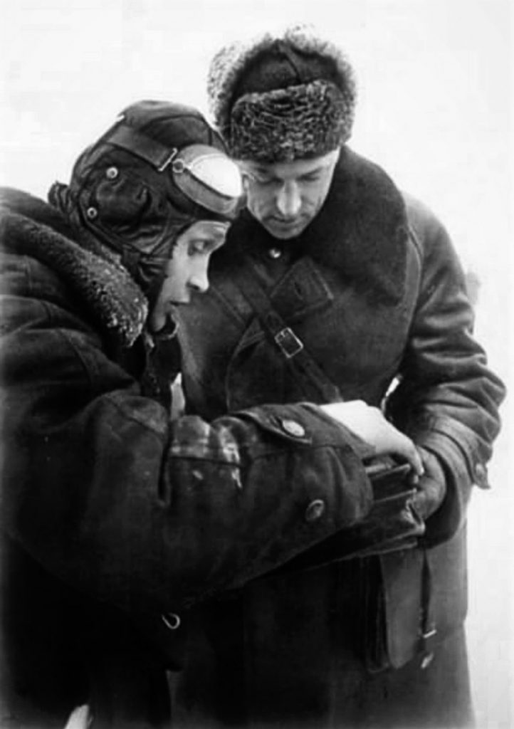 During his command of the Soviet 16th Army, Marshal Konstantin Rokossovsky plans the defense of Moscow as he reviews a map of German dispositions prepared  following an aerial reconnaissance.