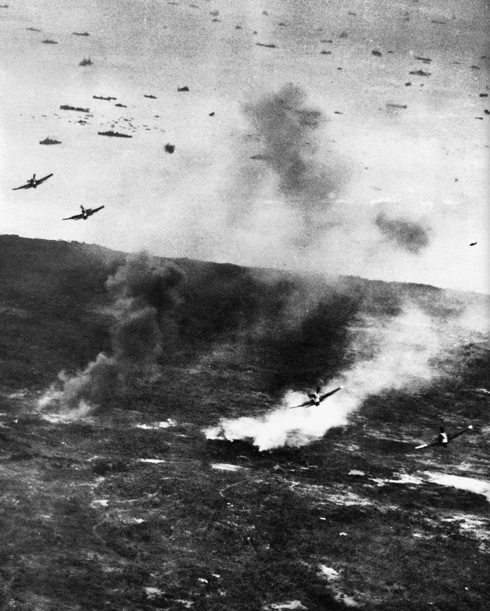 Hellcat fighter-bombers from carriers of the Fifth Fleet release their payload on Japanese positions. 