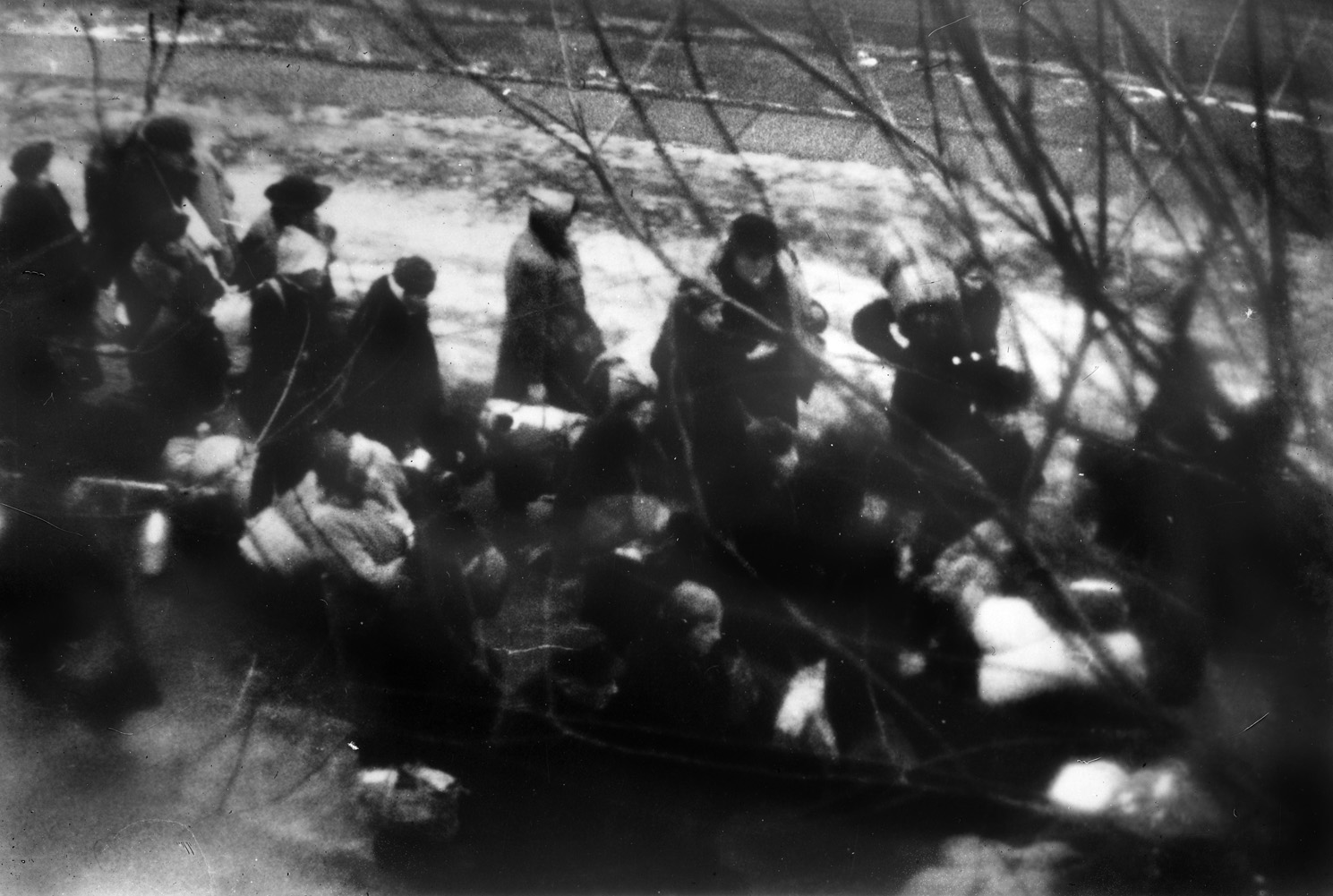 Thousands of Latvian Jews are force-marched to execution pits in a forest at Rumbula. Thirteen thousand were killed in one day. 
