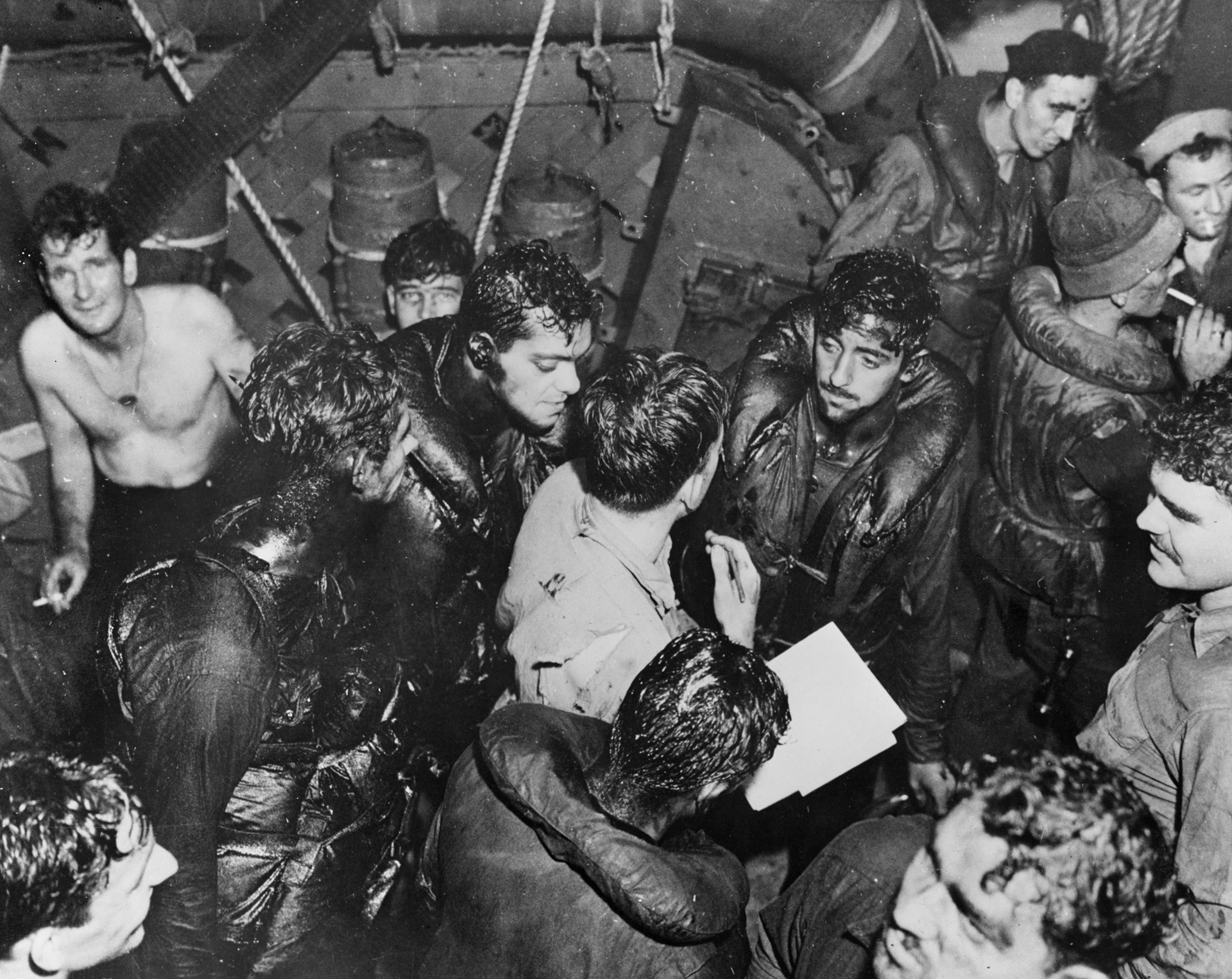 Oil-covered survivors of the torpedoed USS Helena are taken aboard USS Nicholas after the Battle of Kula Gulf, July 5, 1943. Gwin returned to the scene of the battle the next day and rescued 87 more sailors before Helena sank.
