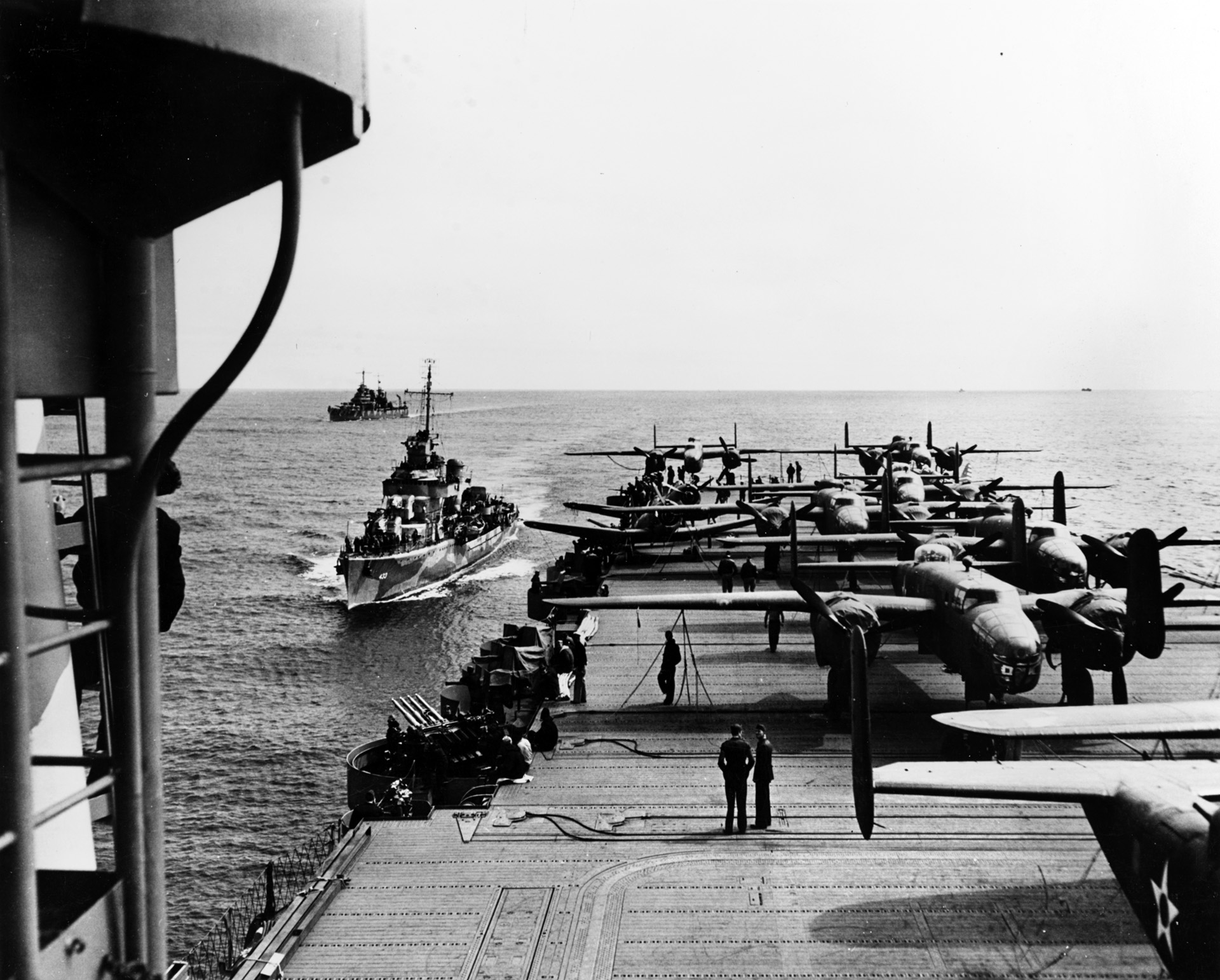 Gwin, left, escorts the American carrier USS Hornet en route to launch the Doolittle Raiders attack on Tokyo, April 1942.