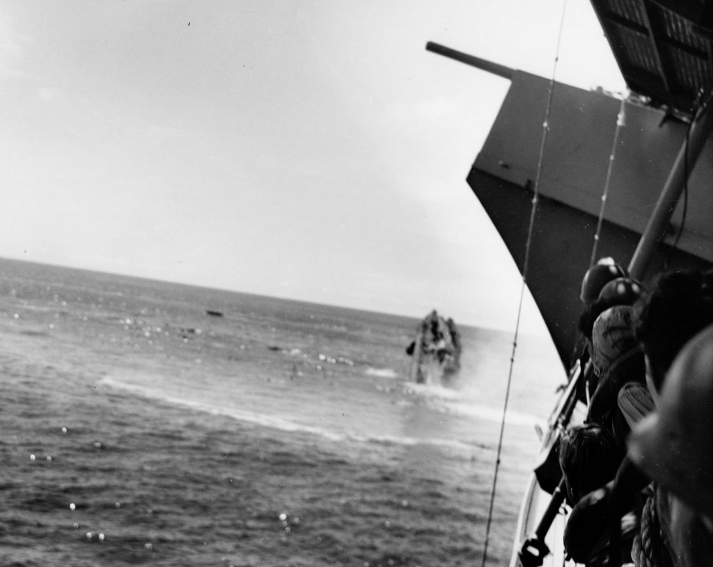 USS Hammann, while assisting Yorktown, sinks after being torpedoed by a Japanese submarine.