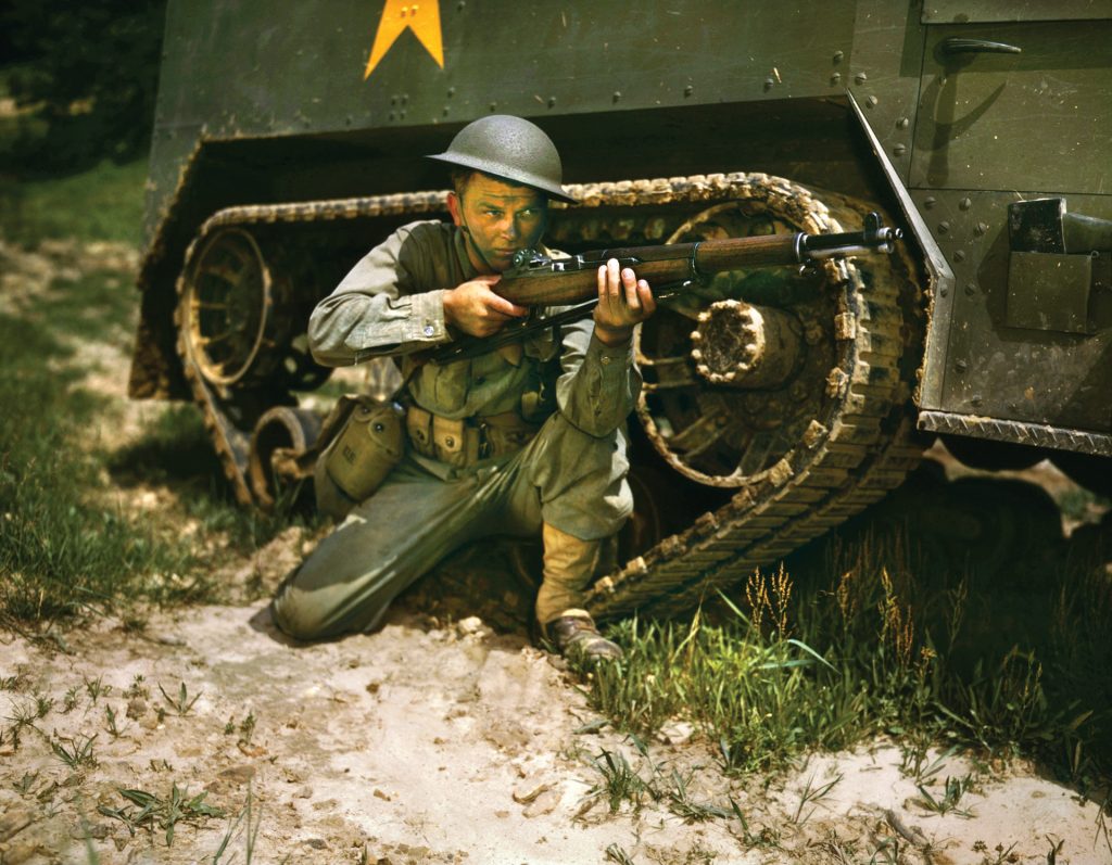 A young soldier of the armored forces trains with a Springfield Arsenal .30-06 M1 Garand rifle at Fort Knox, Kentucky, in early 1942. Soldiers liked the rifle’s rugged construction and dependable operation. A skilled marksman could hit targets at a range of 450-500 yards.