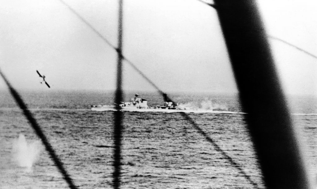 In this photo taken during action against the Italian fleet, a Fairey Albacore torpedo bomber pulls up after releasing its torpedo against the Italian cruiser Pola. The photo was taken from a Fairey Swordfish torpedo bomber.