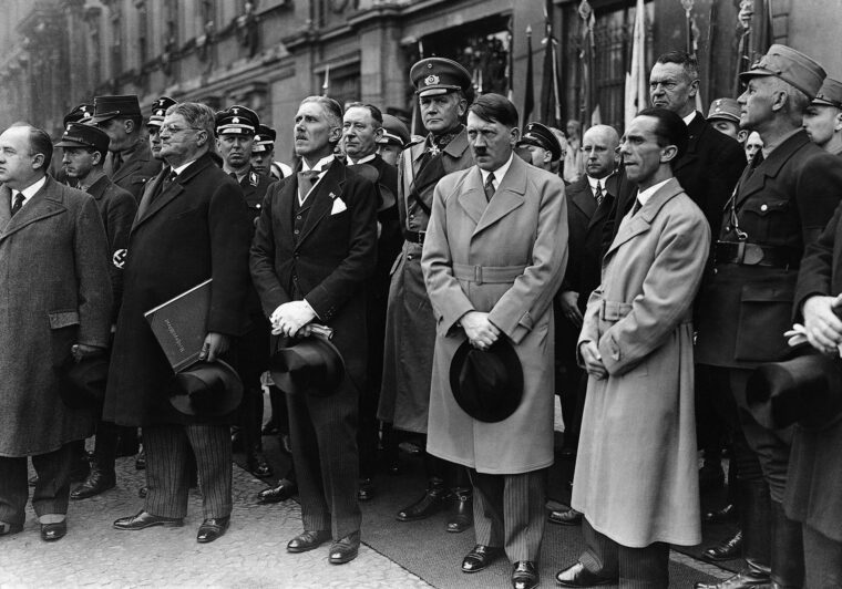 German Ambassador to Turkey Franz von Papen stands at far left, near Adolf Hitler, prior to a Nazi rally before the outbreak of World War II. At right is Nazi Propaganda Minister Josef Goebbels.
