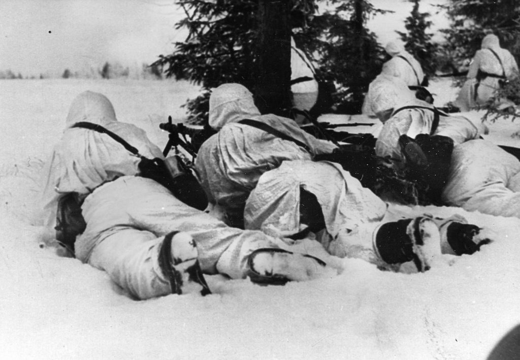 A snowsuit-clad German machine gun squad holds the line. 