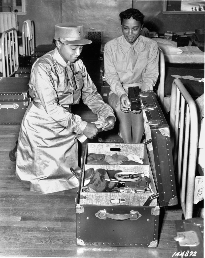 During basic training at Fort Des Moines, Iowa, WACs prepare for a Saturday morning inspection.  Shortly after her unit completed basic training, Lena Derriecott went overseas.